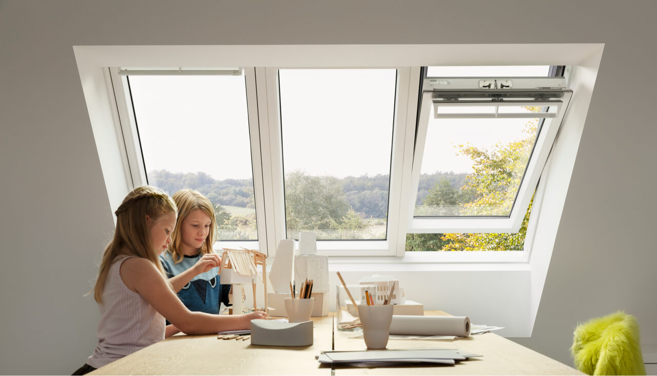 Two kids playing at the table